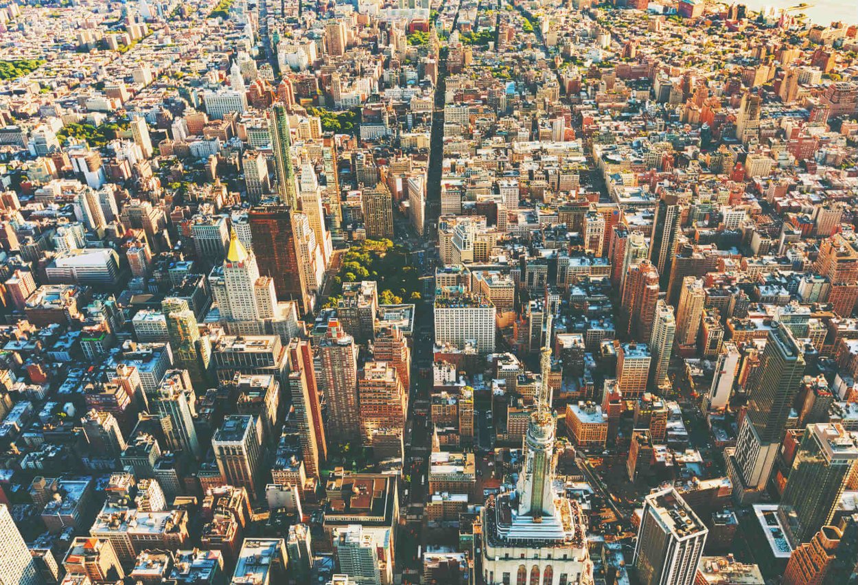 Aerial view of Manhattan — the city’s neighborhoods shape every step of the buying process.