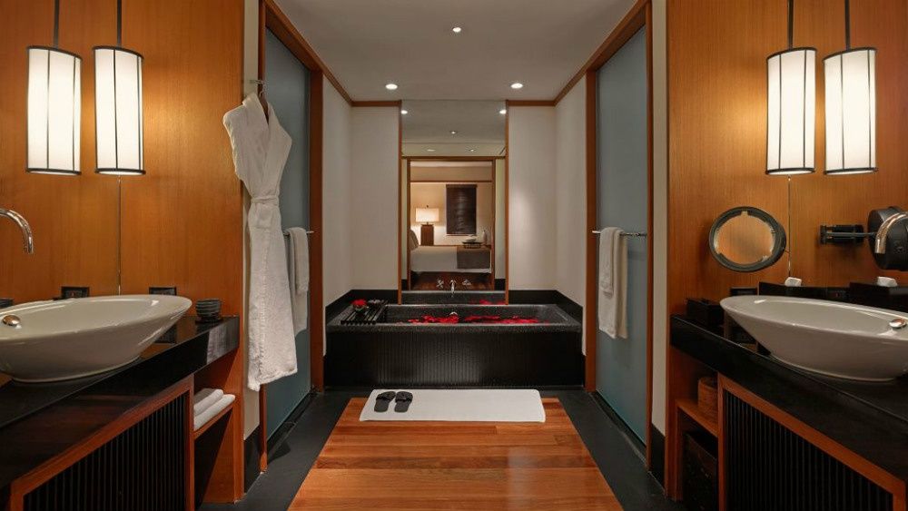 Teak and stone bathroom in a Setai suite